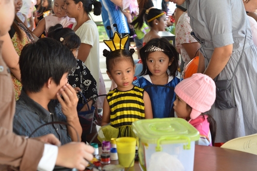 kids in line for face painting