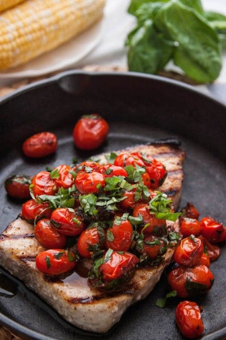 Grilled fish with tomatoes