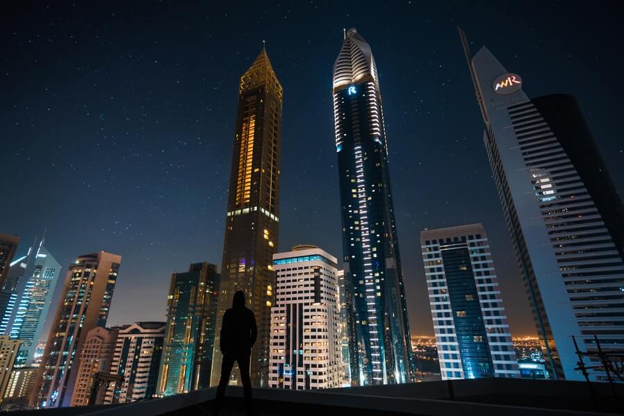 bottom view tall buildings at night