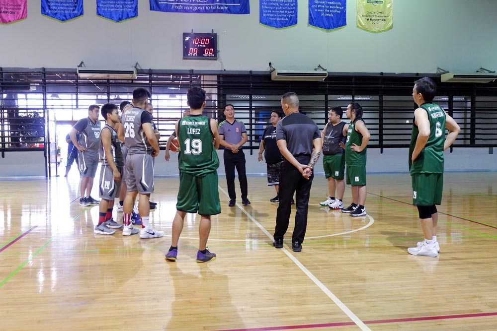Basketball players gathered around