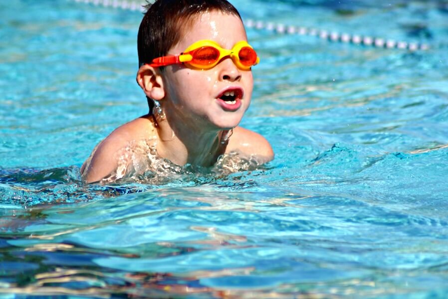 little boy swimming