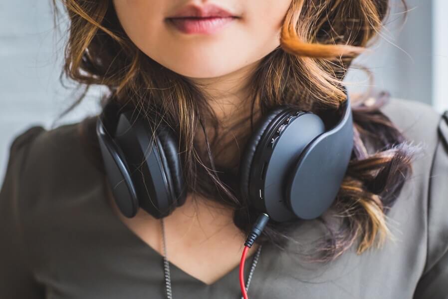 woman wearing headset for music