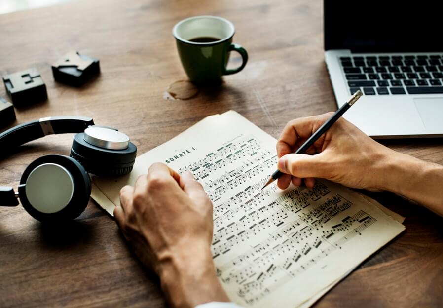 man composing a song