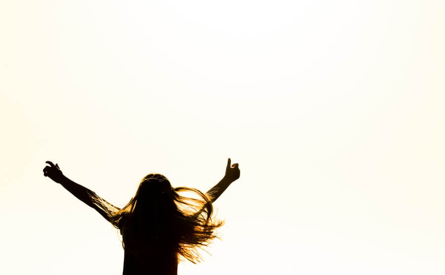 Girl in silhouette jumping