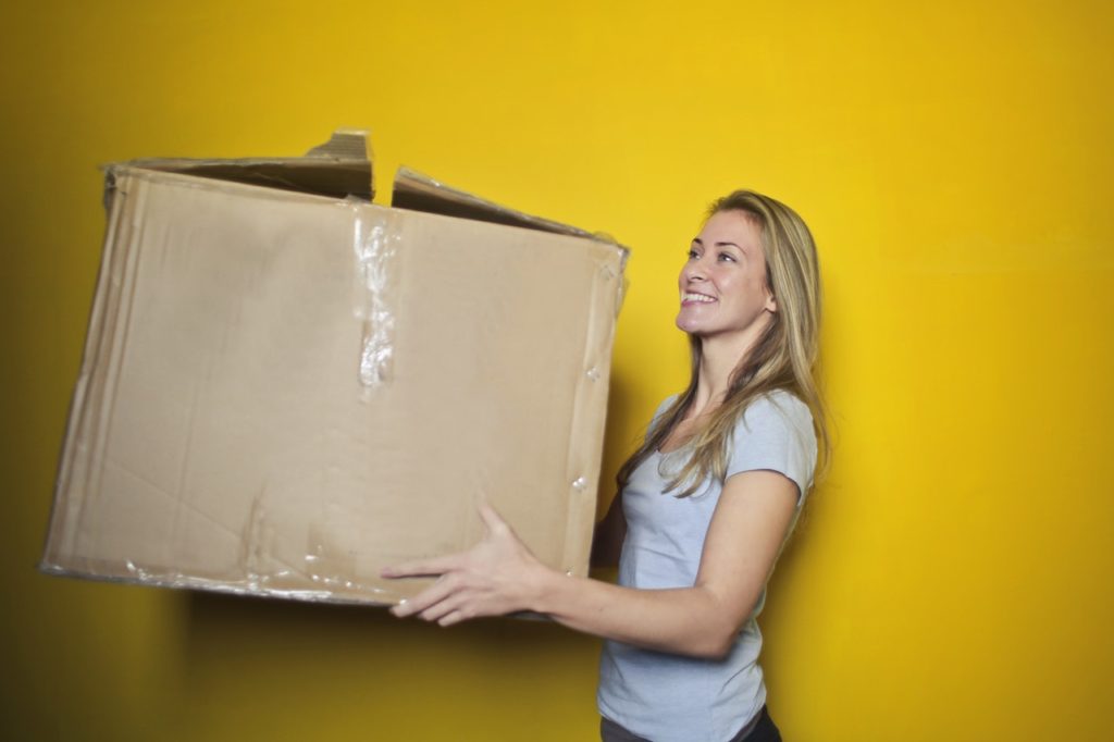 girl lifting a box