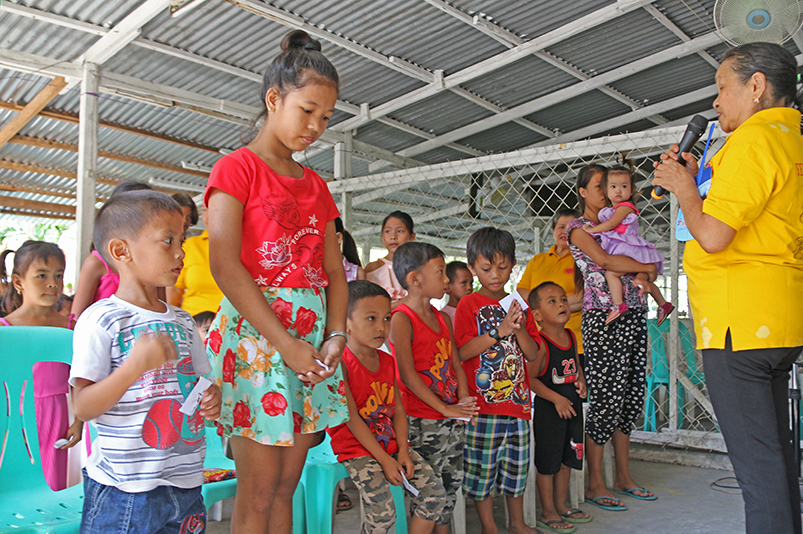 A short prayer marked the beginning of the gift-giving event.