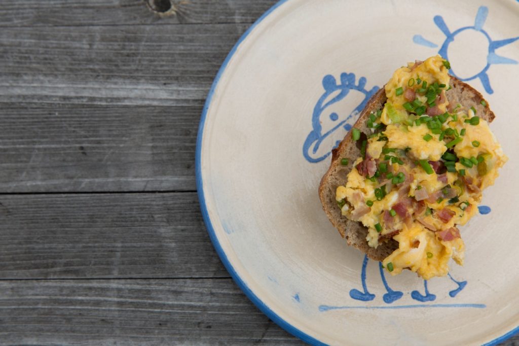 Bacon, eggs, and chives on toast