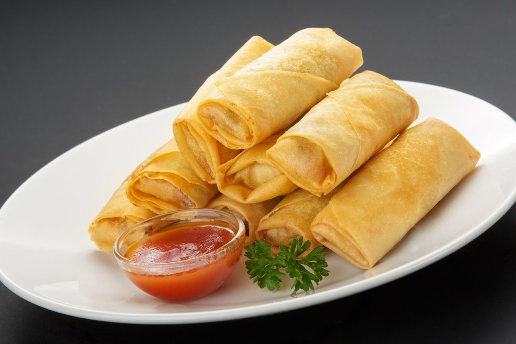 Spring rolls with sweet and sour sauce on a plate