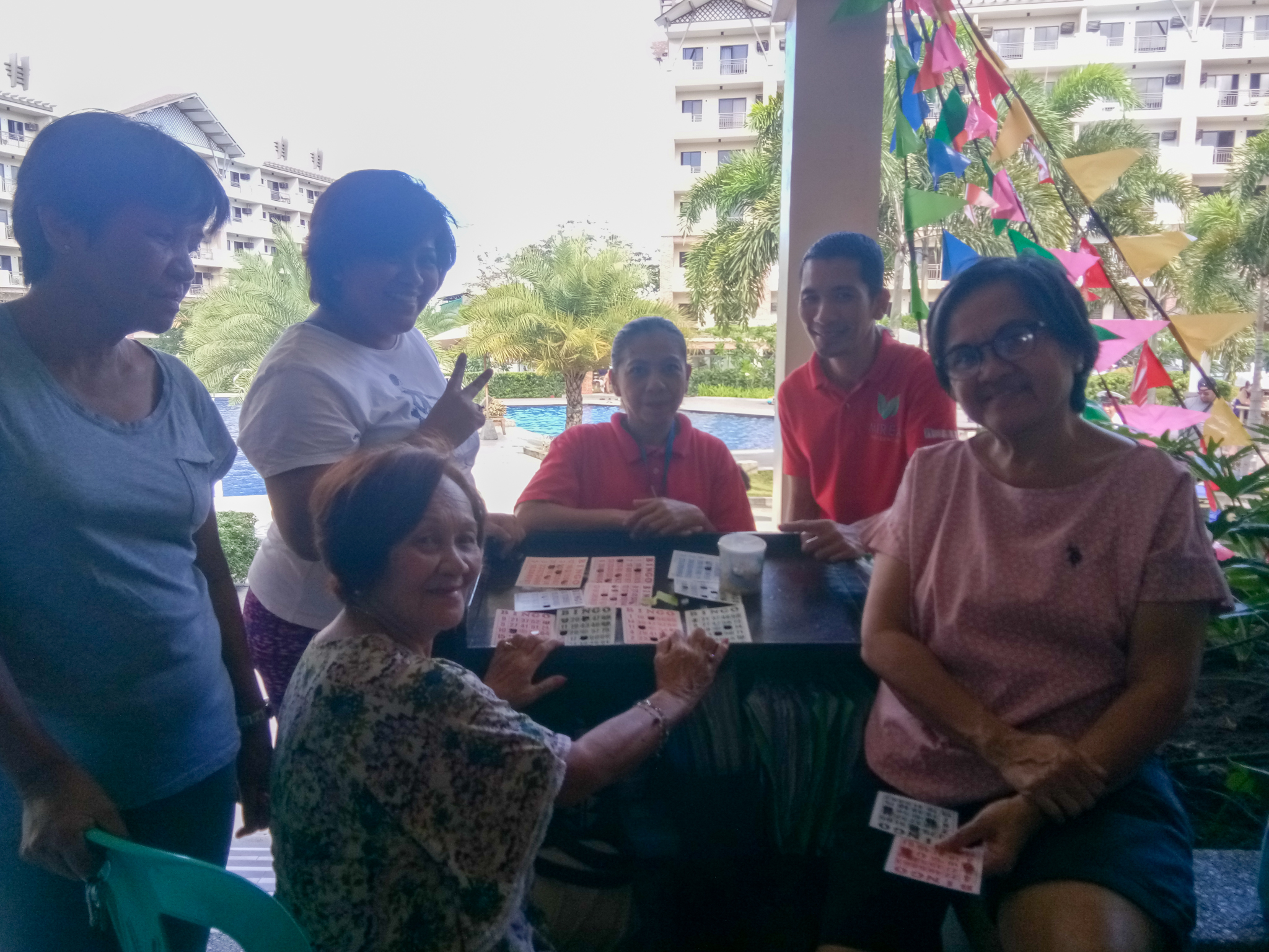 Some senior citizens sharing their smiles while playing the game. 