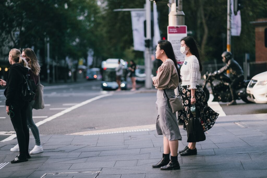 people standing on sidewalk