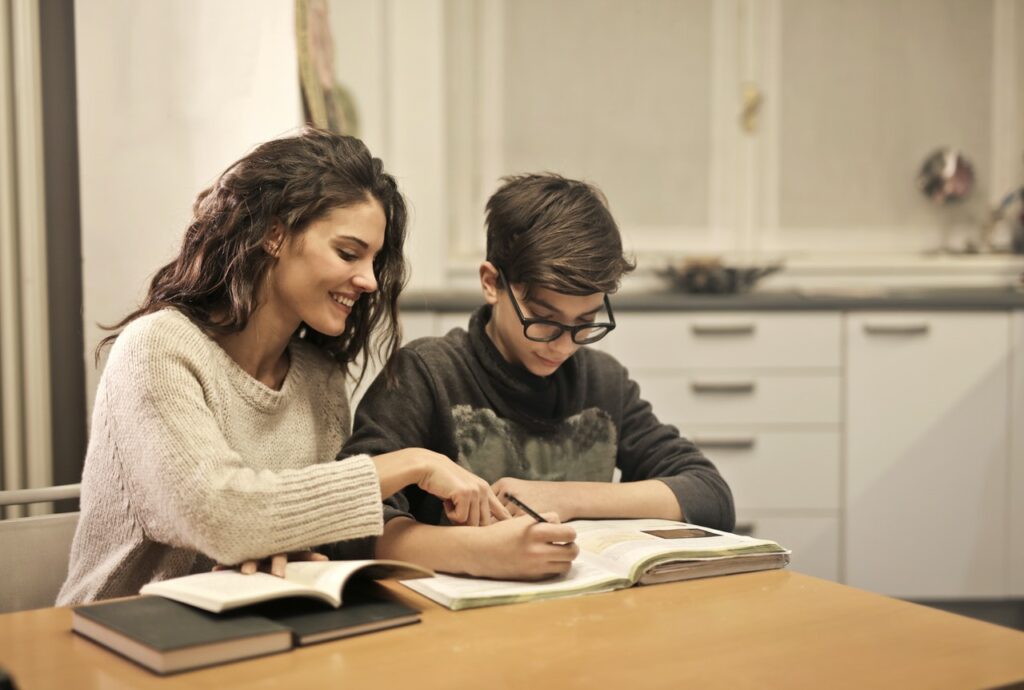 brother sister studying at home