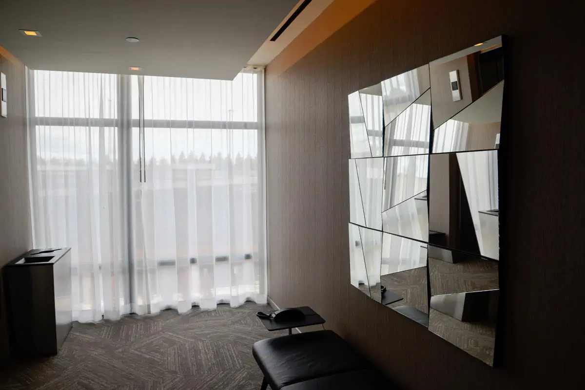 White Window Curtain Near Brown Wooden Shelf