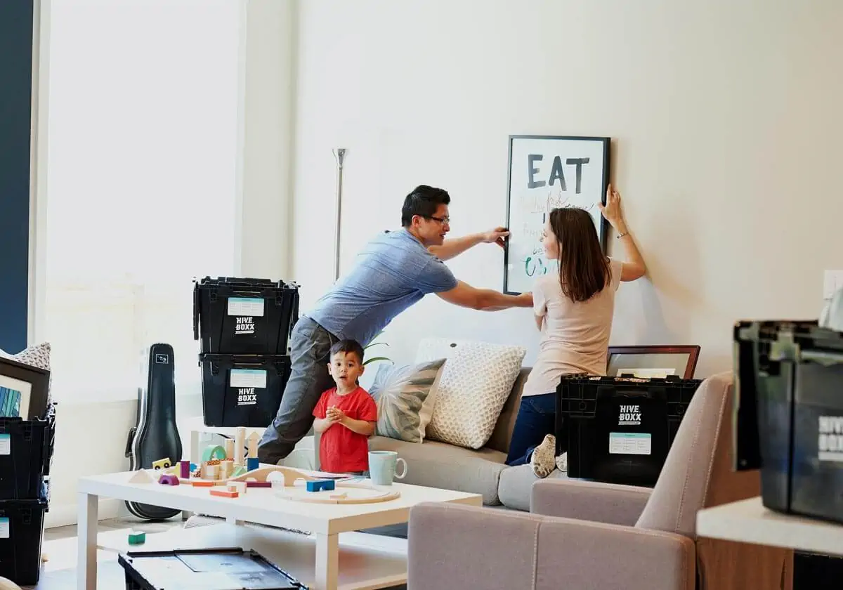 couple holding wall art