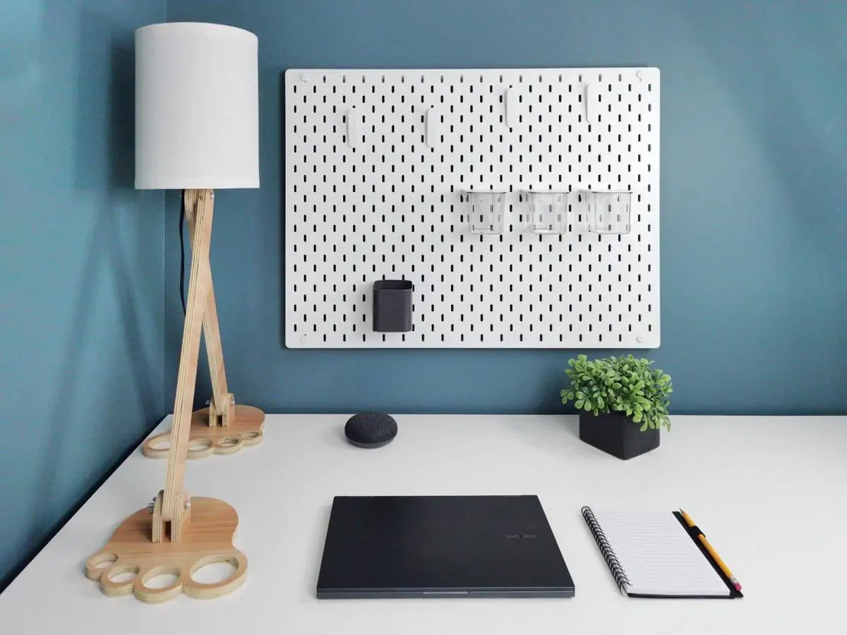 laptop and note on a white table