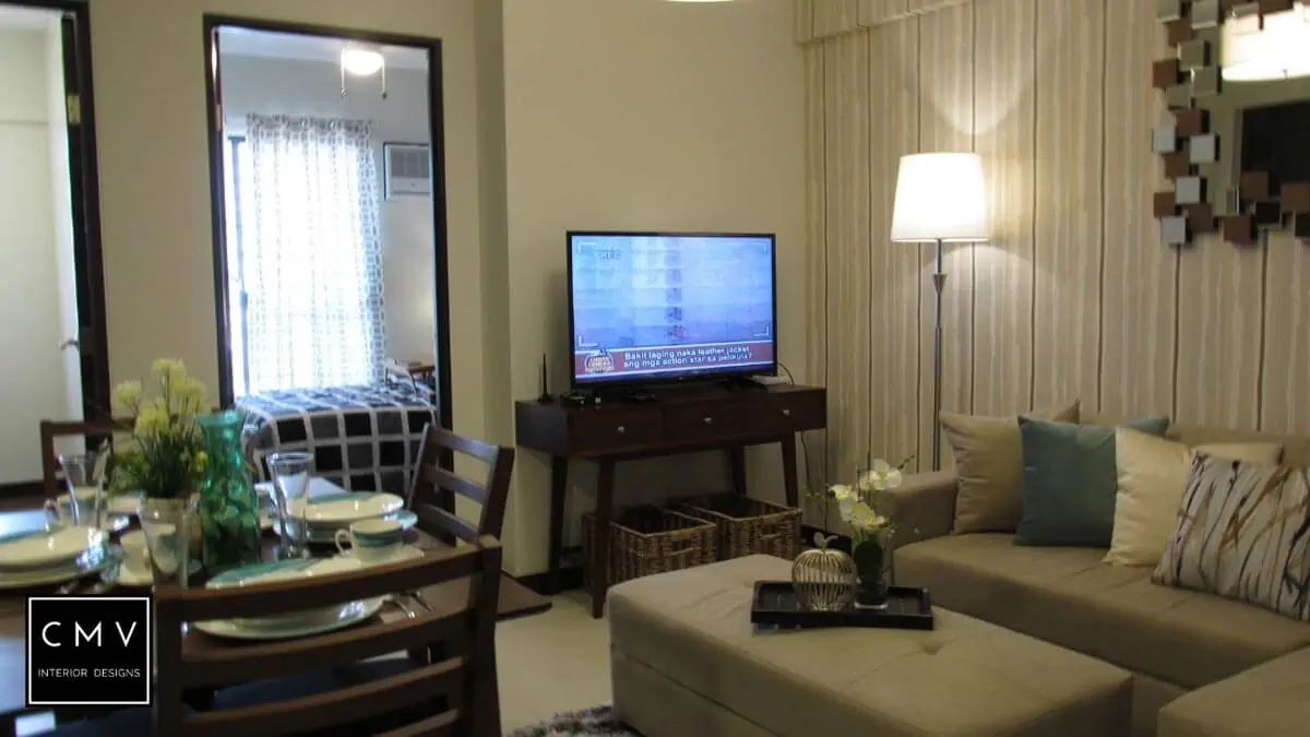 room with table sofa and television