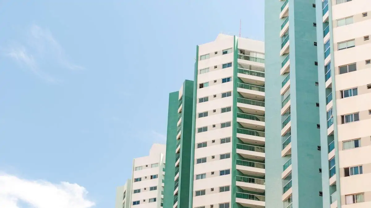 Blue cloudy sky over tall residential building