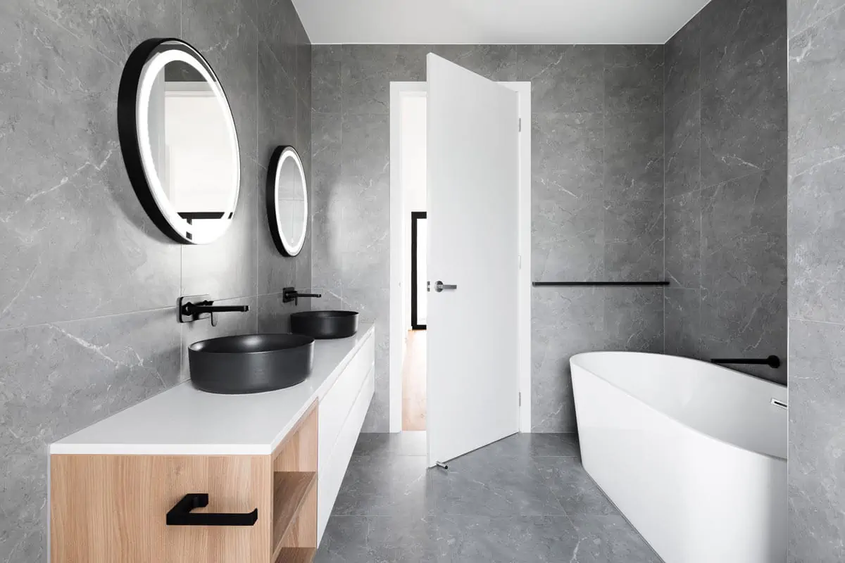 white tub and ceramic sink