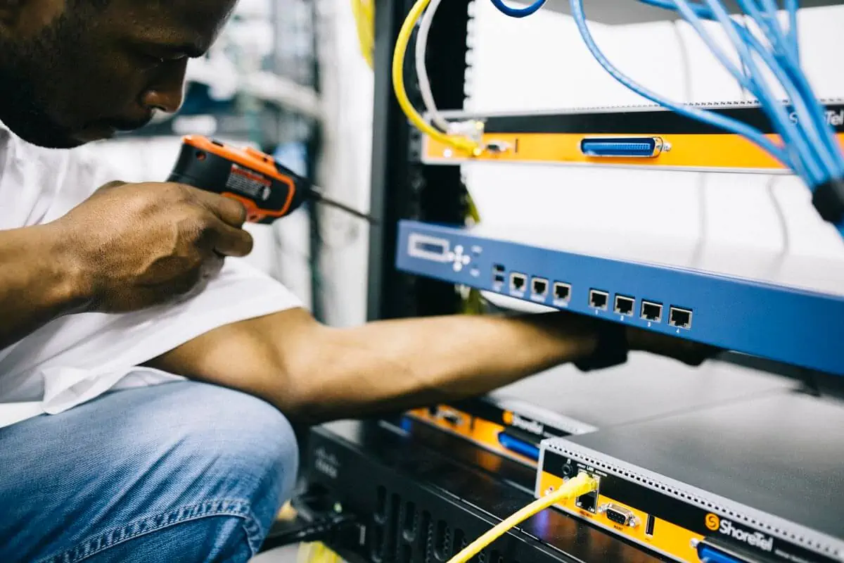 worker fixing cables