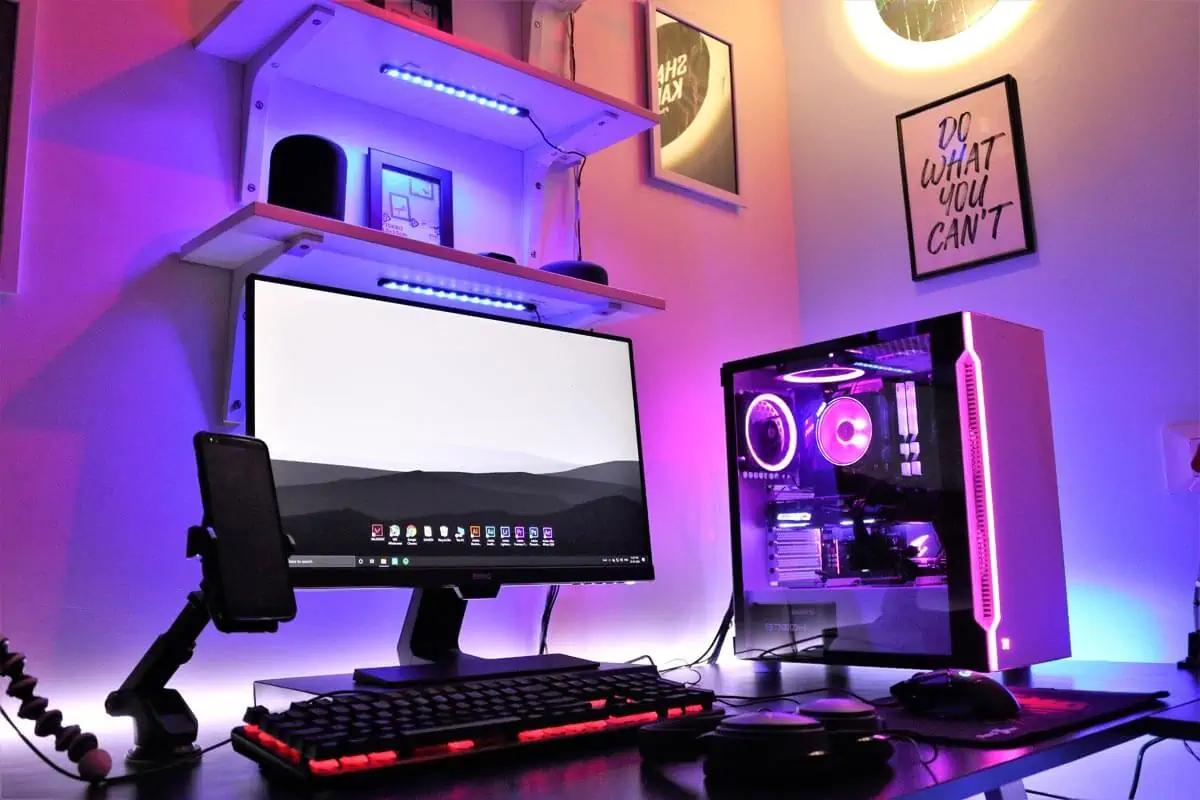 flat screen computer monitor turned on beside black computer keyboard