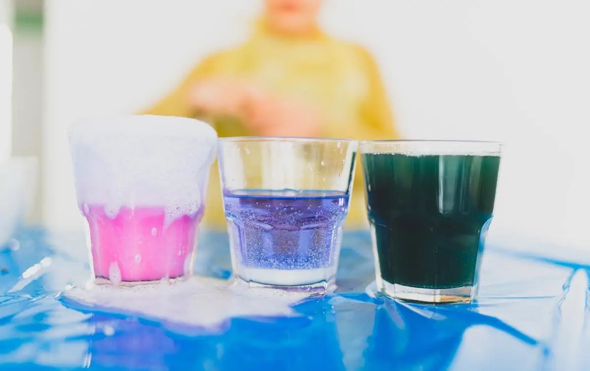glasses with colorful liquids and chemical processes