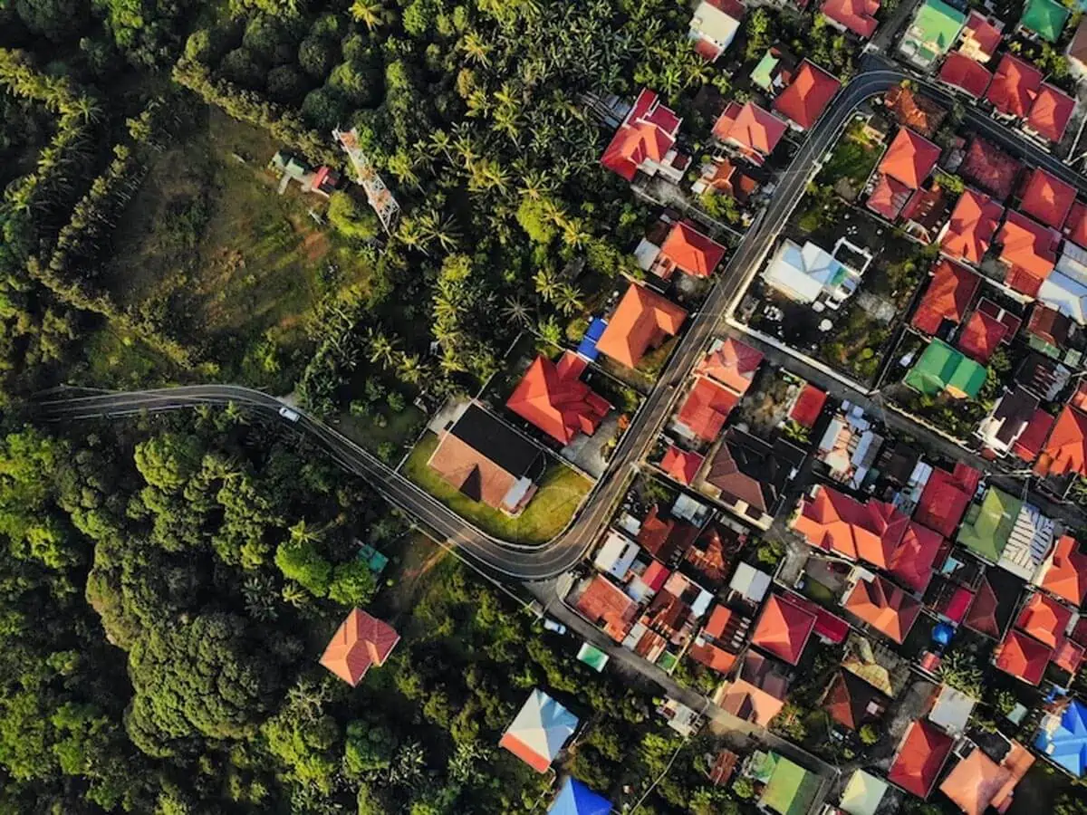 aerial shot colorful buildings surrounded by trees