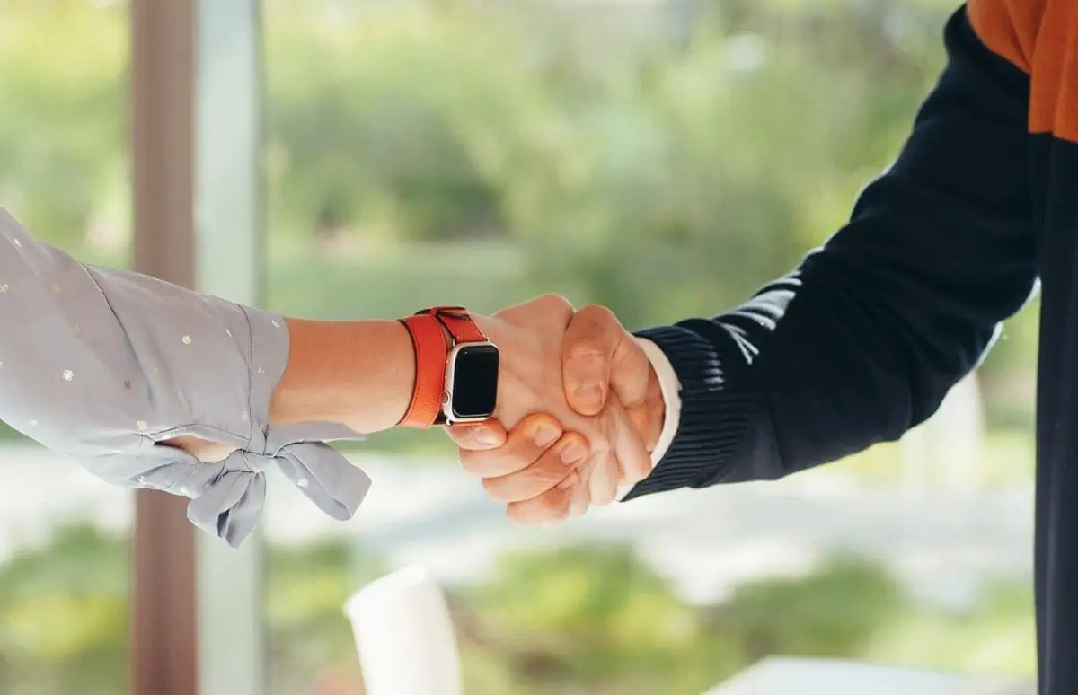 close up photo of people shaking hands
