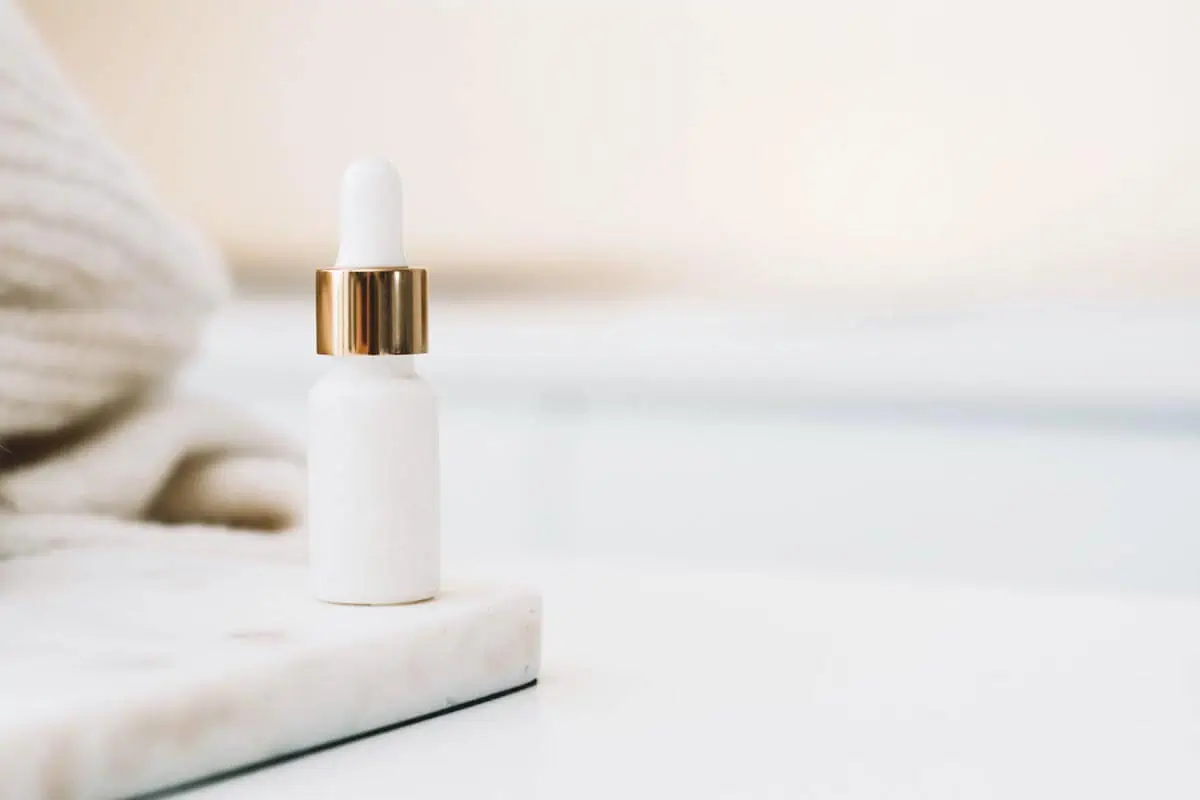 white drop bottle on white surface