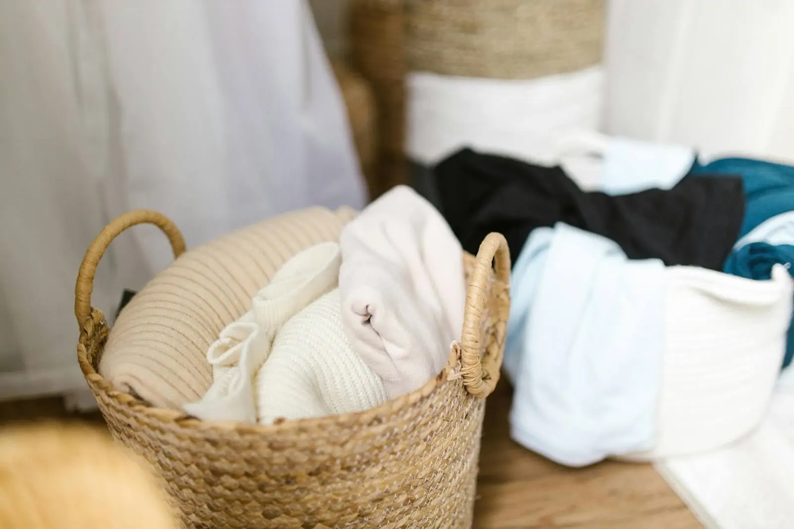 clothing items inside woven baskets