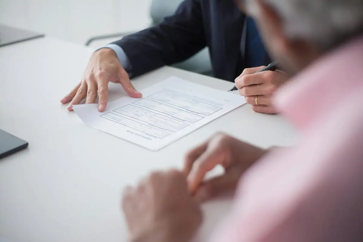 elegant man signing documents