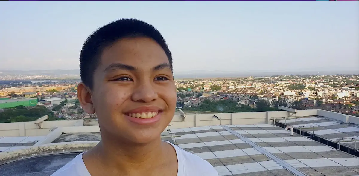 a young kid smiling