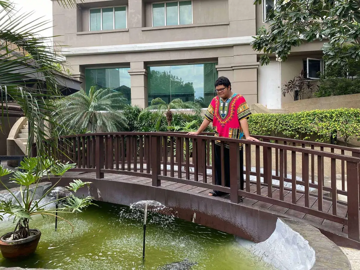 man standing in a small bridge