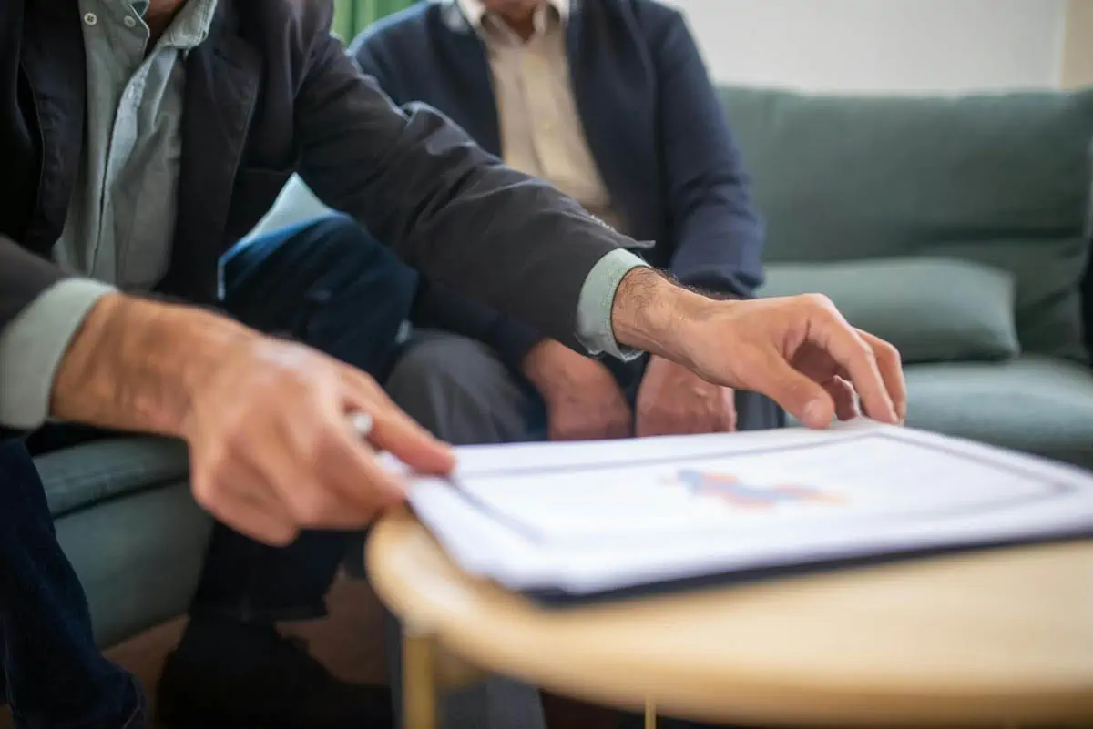 a-man-holding-documents