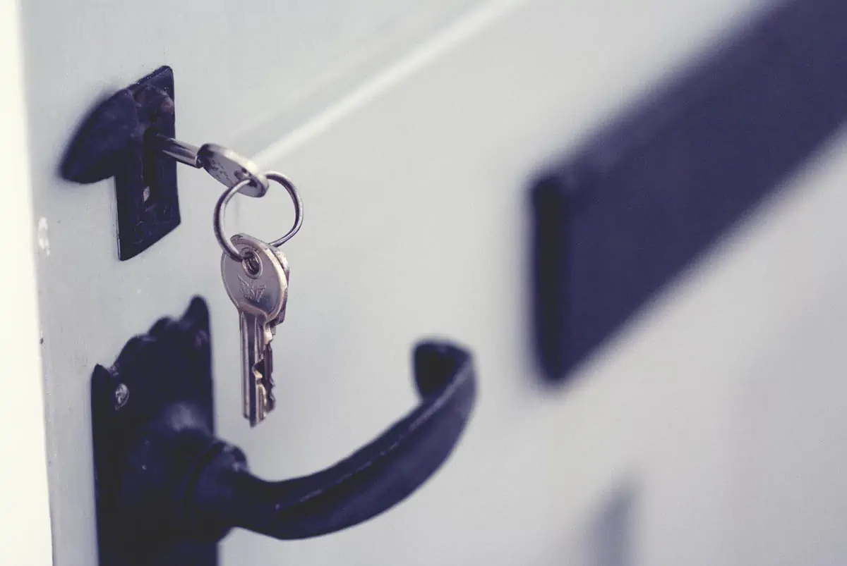 black-and-silver-padlock-on-white-door