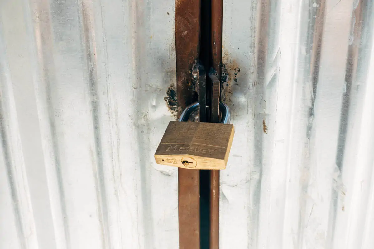 brown-wooden-cross-with-padlock