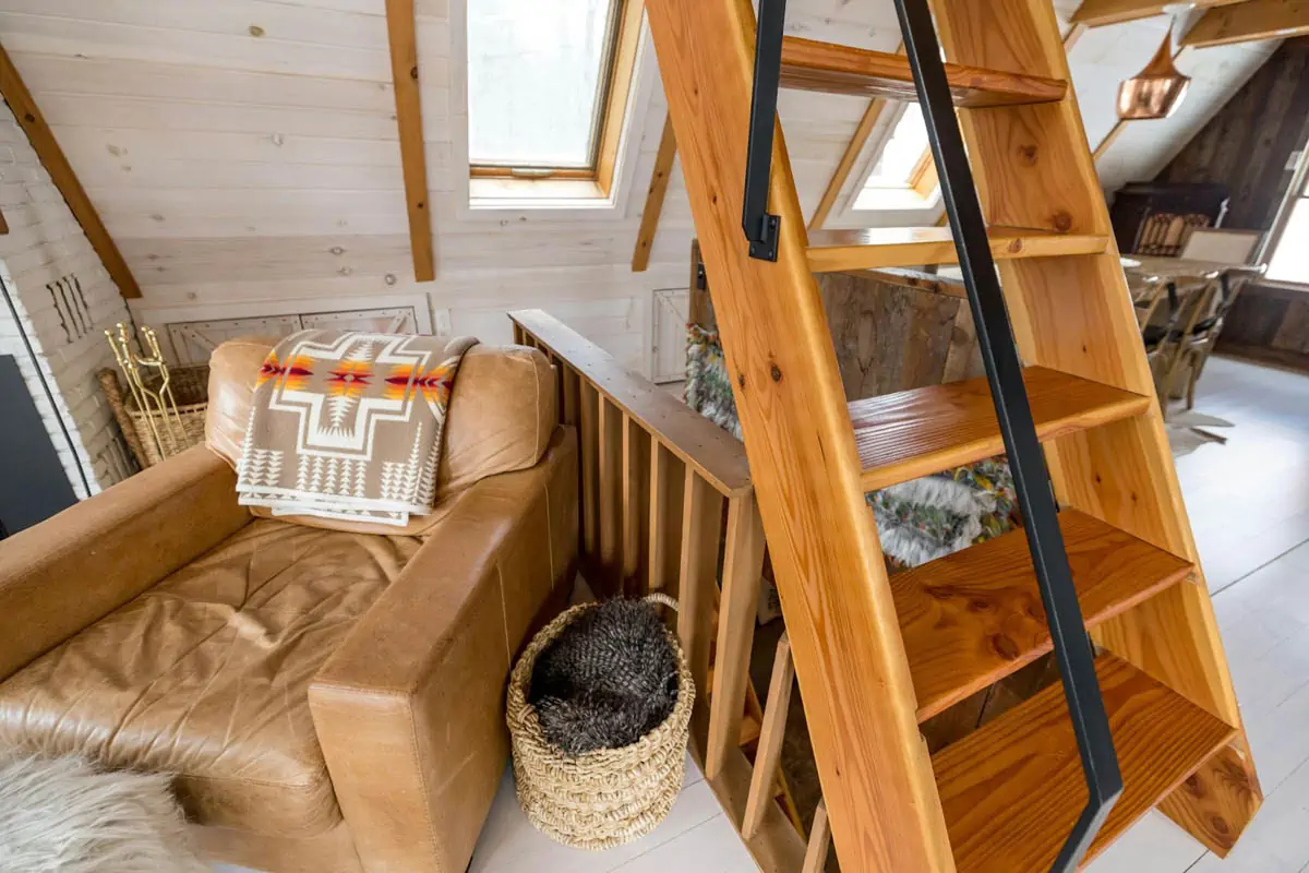 brown-wooden-staircase-with-brown-and-black-pet-bed