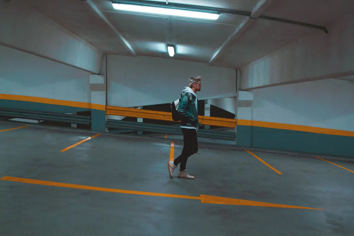 man-walking-on-parking-hall