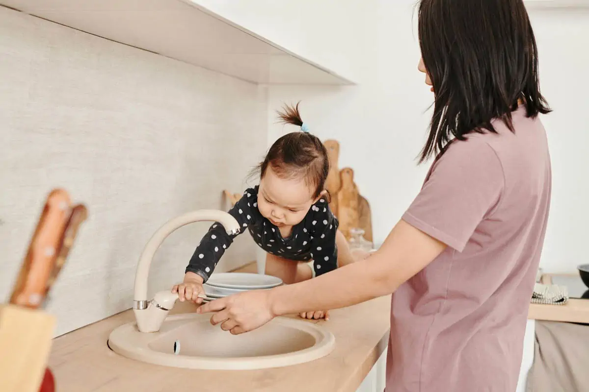 photograph-of-a-child-opening-a-sink