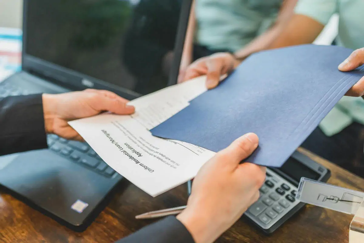 real-estate-agent-giving-a-printed-document