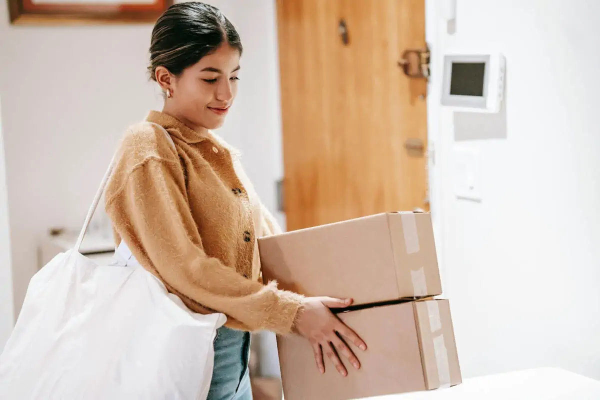 smiling-woman-with-shopping-bag-and-packed-goods