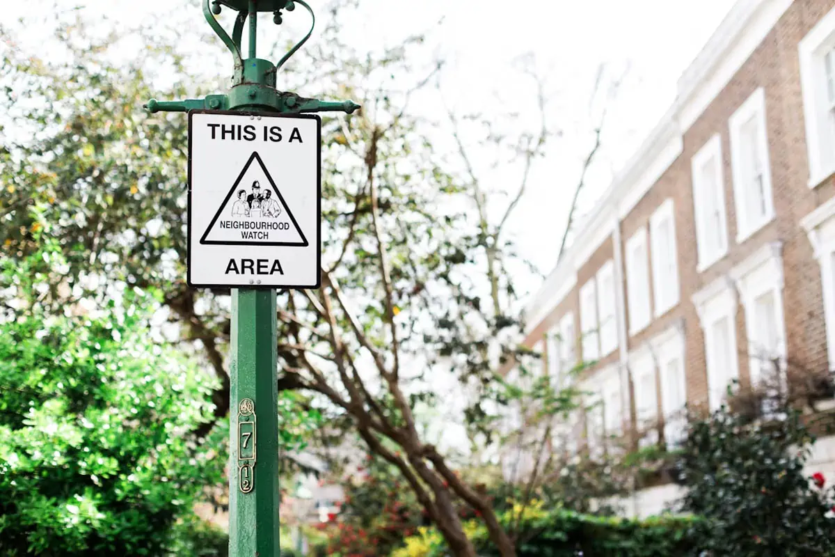 this-is-a-neighbourhood-area-sign-on-green-post