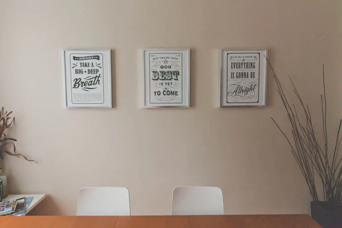 three-rectangular-quotes-on-white-painted-wall