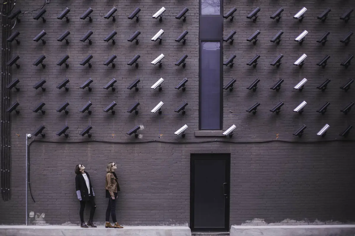 two-women-facing-security-camera